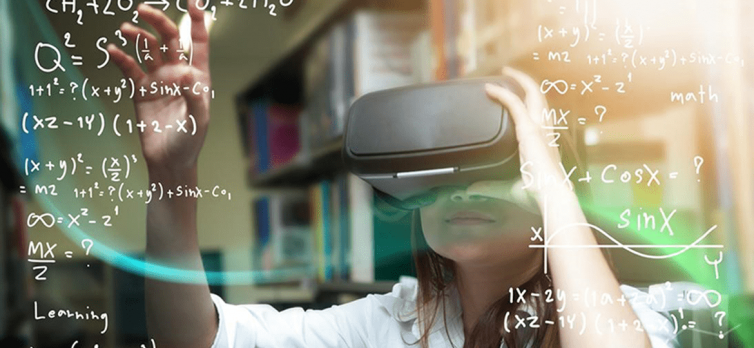 A girl performing mathematics using a virtual reality box