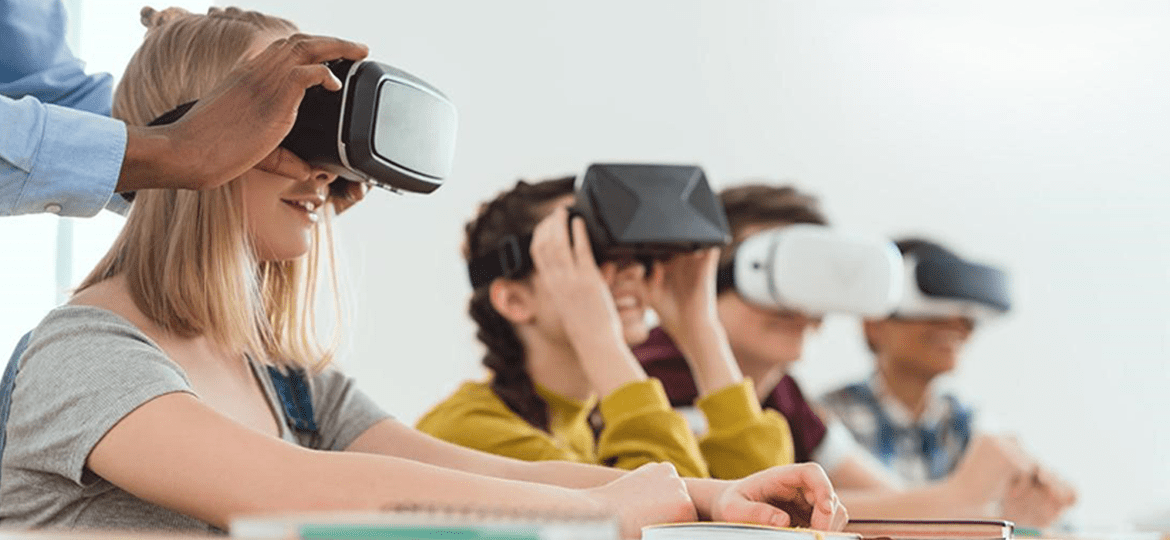 a group of children wearing virtual reality boxes